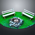 Outdoor Circular Grassy Area With Stone Fire Pit And White Benches