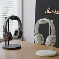 Marshall Audio Headphones In Dark And White On Stands With Modern Design
