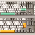 Mechanical Keyboards Two Models with Green and Orange Accent Keys Modern Design 3d model