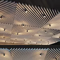 Modern Ceiling Design With Slatted Wooden Panels Geometric Pattern And Recessed Lights