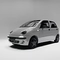 White Compact Hatchback Car With Sleek Exterior And Black Alloy Wheels Design