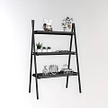 Black Ladder Shelf With Decorative Plants And Miniature Ornaments For Indoor Garden