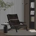 Brown Leather Leisure Chair With Black Frame Side Table Books Floor Lamp And Plant