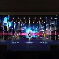 Vibrant Stage Performance With Colorful Lighting Live Music And Background Screen