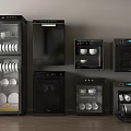 Various Black Kitchen Appliances Neatly Arranged On Wooden Floor And Light Colored Walls