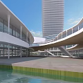 Modern Waterfront Commercial Complex with Glass Facade Curved Roof and Bridge Walkway Under Clear Sky