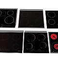 Various Modern Electric Cooktops Kitchen Appliances With Black Glass Panels