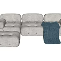 Modern Multi Person Sofa With Gray Textured Fabric And Blue Knit Blanket