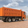 Orange Large Dump Truck Driving On Sandy Ground Under Blue Sky White Clouds