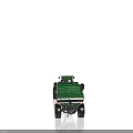 Green Farm Tractor with Pull Behind Agricultural Spreader for Field Work