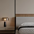 Modern Bedroom with Beige Walls Wooden Flooring Minimalist Design Pendant Light Nightstand and Armchair