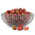 Fresh Ripe Strawberries in Silver Wire Mesh Bowl with Green Leaves and Sliced Pieces Scattered