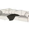 Modern White Sectional Sofa with Plush Pillows and Cozy Blanket for Comfortable Living Room