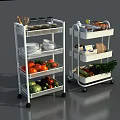 Fresh Vegetables On Multi Tiered Rolling Kitchen Storage Carts With Plates And Utensils