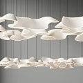 Modern White Wavy Chandelier With Flowing Curved Shapes In Interior Space
