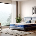 Blue Upholstered Double Bed With Mattress Potted Plant And Mountain View Through Large Window