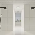 Modern Multi Stall Restroom with White Tiled Walls and Black Showerheads