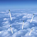 Green Missile Flying Through Cloudy Sky With Trailing White Smoke 3d model