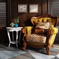 Vintage Yellow Single Sofa With Wooden Frame Floral Cushions Side Table Wall Art Geometric Rug