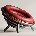 Modern Red Leather Lounge Chair With Circular Layered Rings And Metal Frame Design