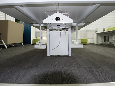 Large White Industrial Equipment with Black Circular Top and Metal Support Frames in Indoor Facility 3d model