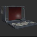 Vintage Commodore Portable Computer With Red Screen And Gray Keyboard