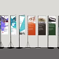 Multiple Banner Stands Displaying Various Content With Different Colors And Black Stands