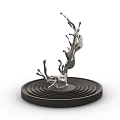 Silver Metallic Liquid Splash Sculpture On Black Circular Base With Concentric Rings 3d model
