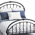 Black Metal Single Bed with Curved Frame White Patterned Linens and Navy Pillows