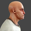 Bald Man Wearing Light Shirt With Dark Collar On Grey Background