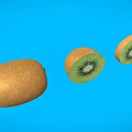 Fresh Whole Kiwi and Sliced Kiwi with Green Flesh on Blue Background