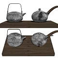 Black Iron Tea Sets Displayed On Wooden Platform With Traditional Design
