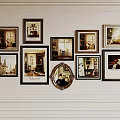 Multiple Framed Abstract Paintings With Various Scenes And Circular Mirror On White Decorative Wall