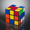 Colorful Rubik's Cube With Red Yellow Blue Green Orange White Squares On Dark Reflective Surface