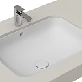 Modern White Built in Washbasin with Chrome Faucet on Light Countertop