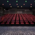 Cinema Interior With Red Seats Dark Walls And Colorful Ceiling Lights