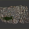 Natural Stone Pebbles With Various Colors And Small Green Grass In Center