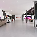 Modern Car Showroom Interior With Red Sports Car And Displayed Luxury Vehicles