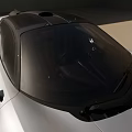 Silver Sports Car With Black Roof Streamlined Body Black Rims And Unique Headlights