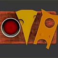 Yellow Cheese Slices with Holes on Red Mat and Silver Goblet