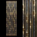 Decorative Hanging Installation with Vertical Gold And Silver Strips Featuring Lighting Effects Against Black Background