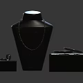 Elegant Jewelry Display Featuring Necklace Ring Earrings On Black Display Stand With Black Boxes