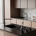 Modern Kitchen Black Sink With Faucet On Sleek Countertop And Cabinets