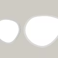 Two Different Sizes Modern Irregular Mirrors With Black Frames On White Wall