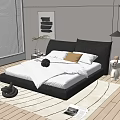 Modern Double Bed with Black Headboard White Sheets Yellow Pillows and Wooden Floor Bedroom