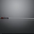 White Pen With Red And Blue Accents On Smooth Dark Surface With Reflection