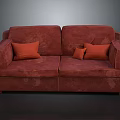Comfortable Red Upholstered Two Seater Sofa With Orange Decorative Pillows