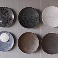 Wall Decor With Circular Plates In Various Colors And Textures On Gray Wall 3d model