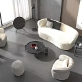 Modern Elegant Living Room Interior With White Curved Sofa And Round Coffee Table Set
