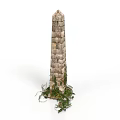 Ancient Brick Obelisk Structure With Green Plants Growing At The Base